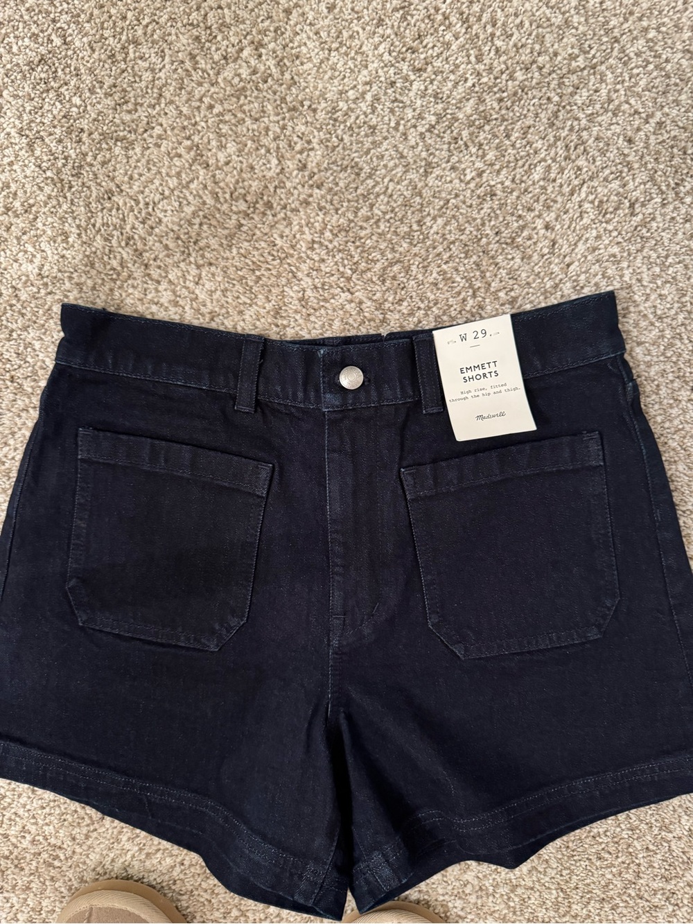 Madewell dark denim Emmett patch pocket shorts.
